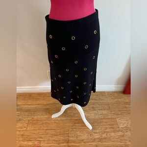 Tory Burch Black Merino Wool skirt, with gold grommet details, size M.